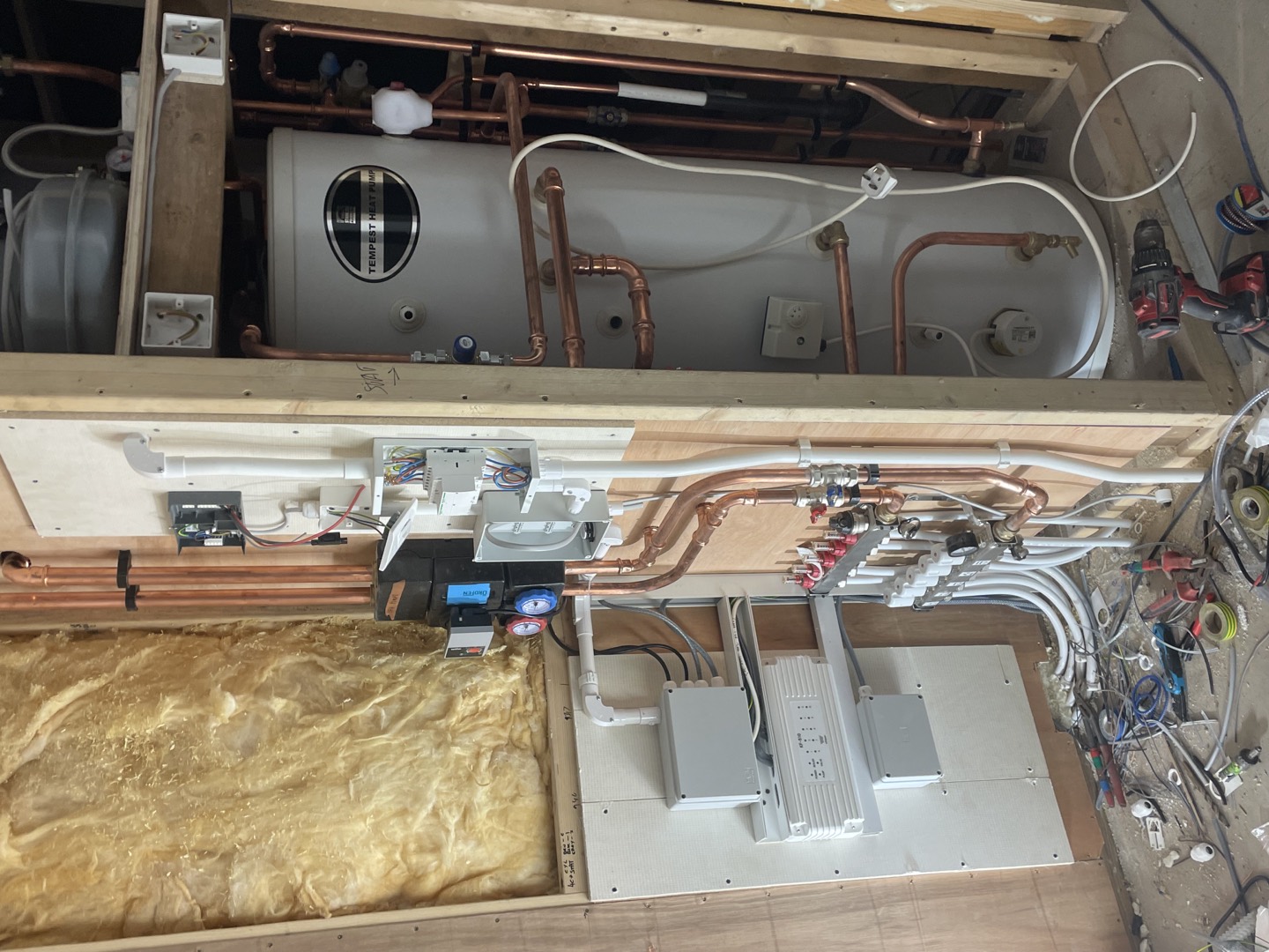 Integrated heating, plumbing and electrical controls under installation